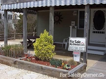 #4 Unit #1 (1st floor)
						:
						Covered concrete & wood deck Porch