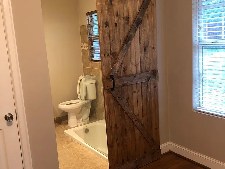 barn door to full bath