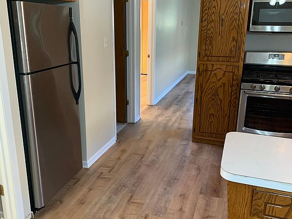 Kitchen with stainless steel fridge.