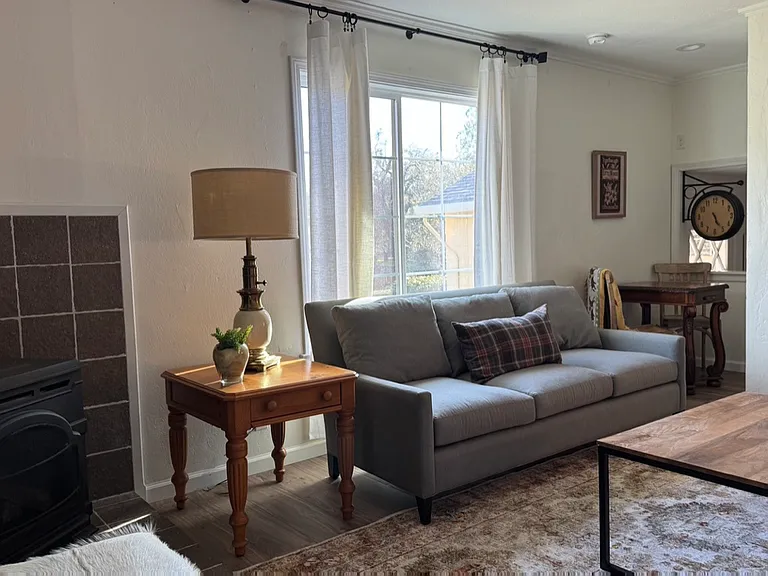 Living room with recessed lights, gas stove, central heat & air