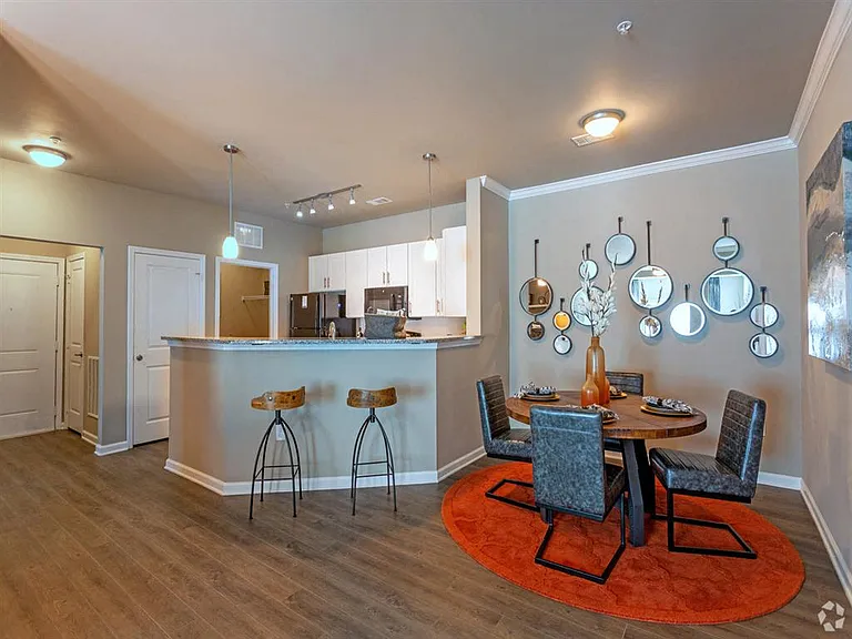 Kitchen with breakfast bar and dining area