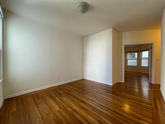 Living Room with bedroom shown in background