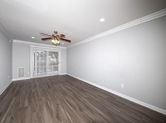 Vinyl Plank Floor, Gray Wall Paint, Crown Molding, High-Hats, Ceiling Fan, Sliders to Terrace