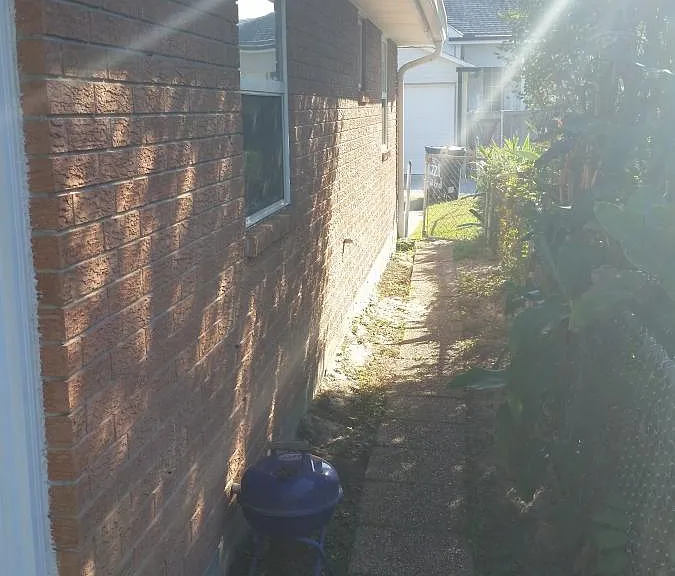 side entrance leading to one parking spot in service alley