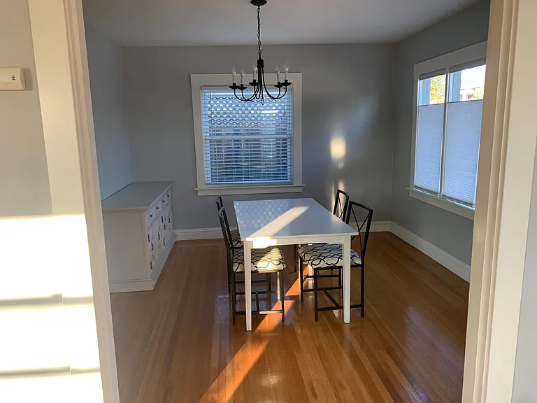 Formal dining room with buffet table. Table, chairs, and buffet table can stay or be removed/discarded.