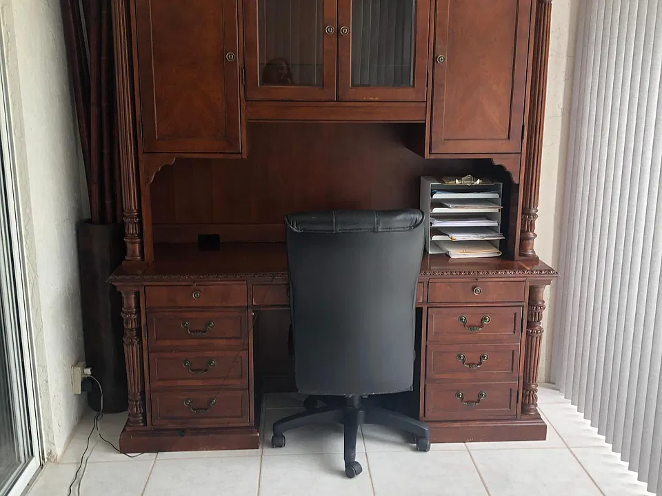Florida room with desk and sofa bed