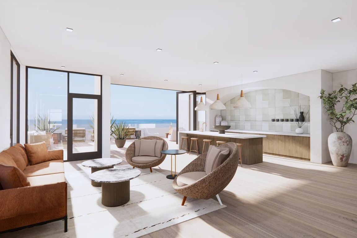 Sky lounge with private dining space and rooftop terrace with panoramic ocean views.