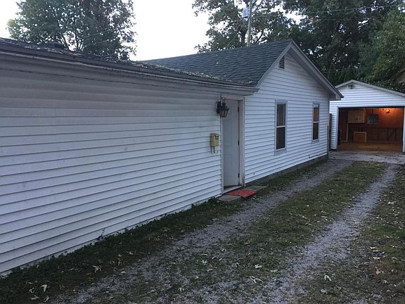 Side of home and front door entrance