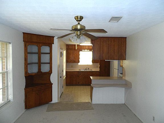 Kitchen opens up to the living area, to your left is a built in hutch & to your right is a breakfast