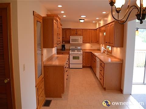 Kitchen with Oak Cabinets and Tile Floor