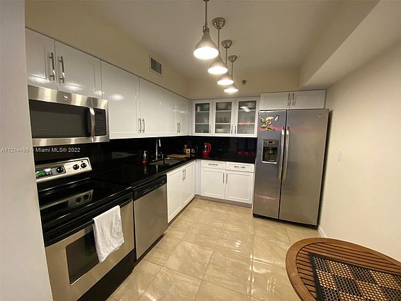 5th image of 3600 Mystic Pointe Dr APT 717