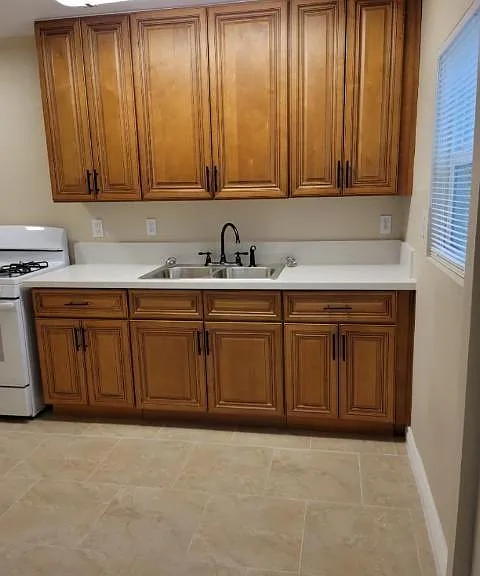 New sink and kitchen cabinets offer plenty of storage