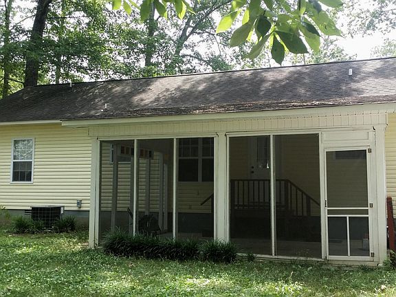 Shady, fenced in back yard, screened patio.