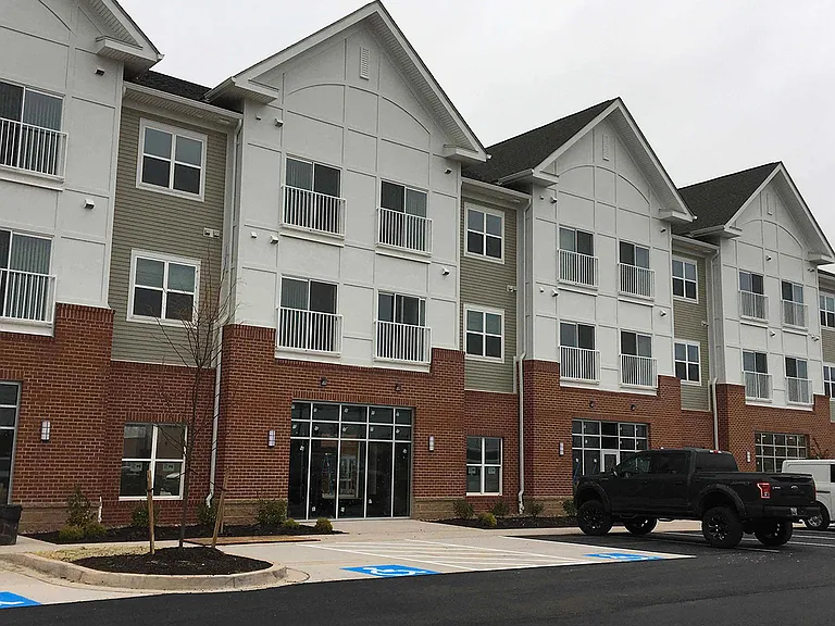 Exterior front of building with parking lot