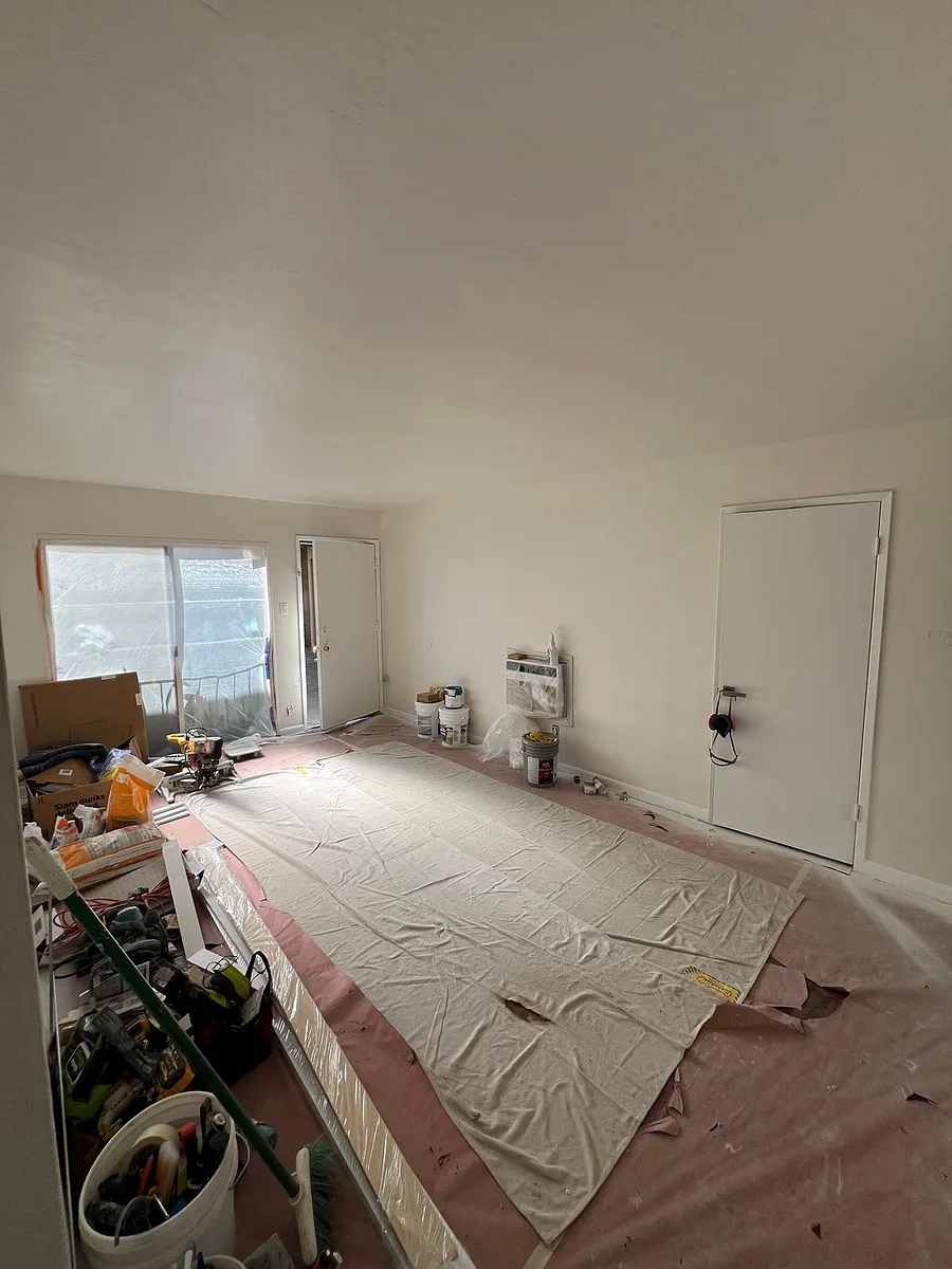 Completing renovation. Wood floors under the tarp. Paint is still drying. - 2335 Chestnut St #2