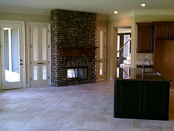 See through fireplace from the breakfast ares to formal dining area.