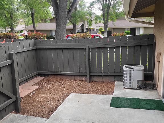 Got to have the A/C for you. Patio has gate to the walkway to your garage. Pretty private!