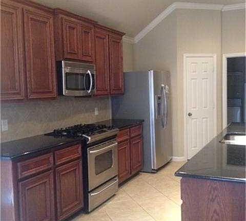 Kitchen with beautiful 42-inch cabinets & granite counter tops.