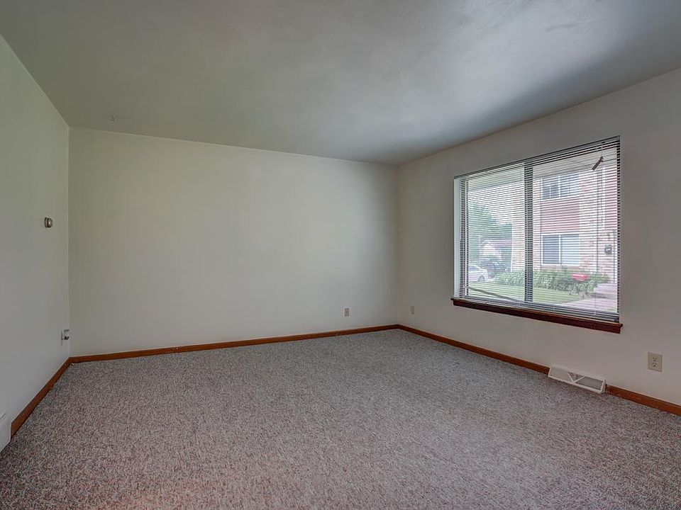 Photos are of a comparable unit (same layout); cosmetic details may differ. Available unit 5809-3 has newer LVP flooring throughout the entire main floor