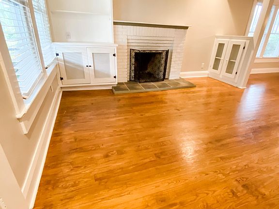 Living room with fireplace and built-in cabinets