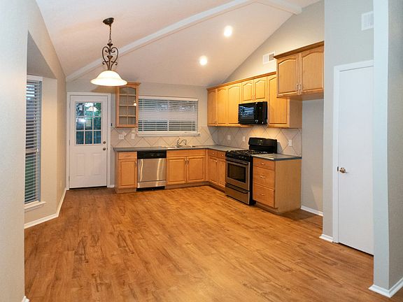 Kitchen with dishwasher, microwave, stove/oven, and garbage disposal