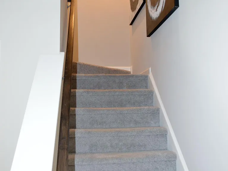 Stairs heading from the first (ground) level up to the second floor.