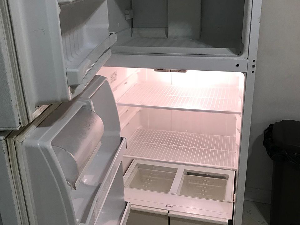 Clean refrigerator with clear plastic shelving