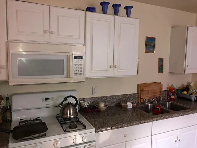 Large kitchen with granite countertops