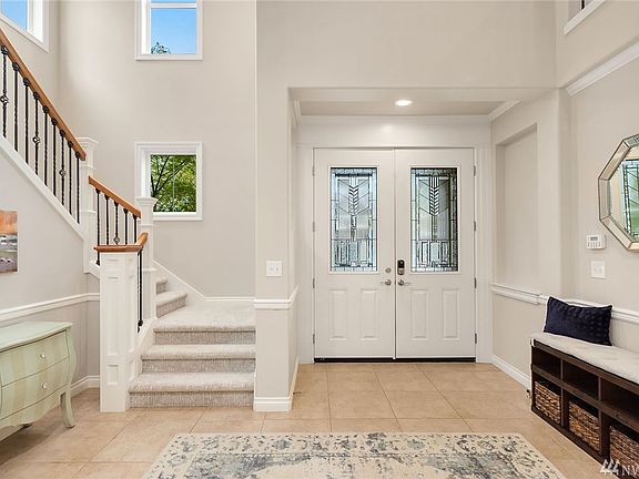 2 story entry, double doors, wrought iron staircase, welcome! 