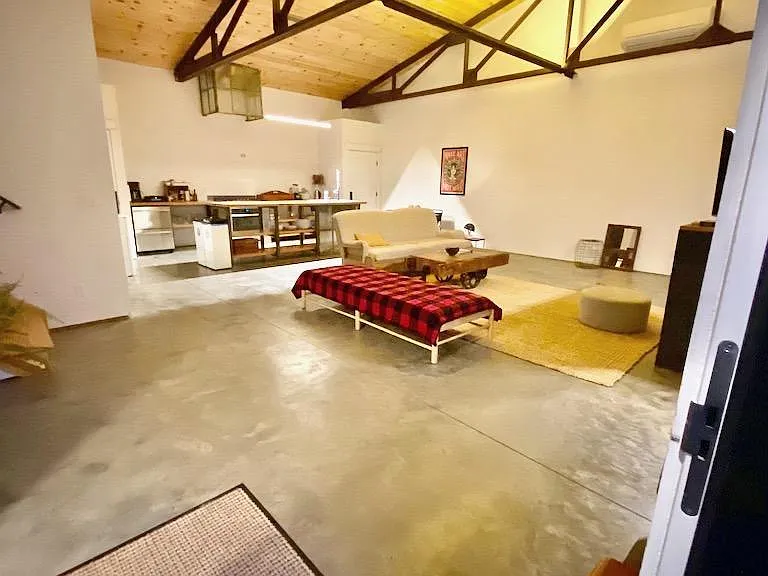Living Area with Kitchen Area in Background