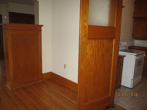 Swinging door between dining room and kitchen.