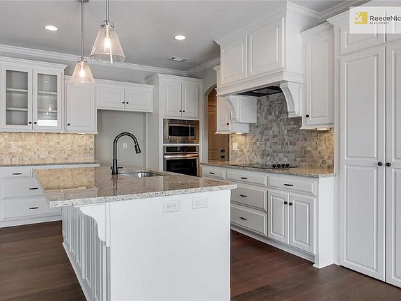 5 Piece Appliance package provides wall oven and microwave above * Vent above cooktop * Dishwasher in the Island