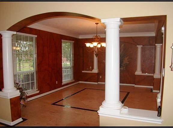   FORMAL DINING WITH CUSTOM FAUX PAINT, COLUMNS,CROWN MOLDING &TRAVERTINE FLOORS W/GRANITE INSERTS.