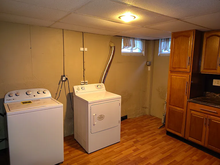 Basement kitchenette and laundry room.
