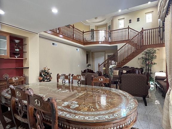Downstairs living room view with beautiful the Dining Table set.