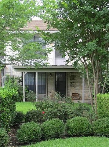 Covered rear patio overlooking spacious greenery and just st