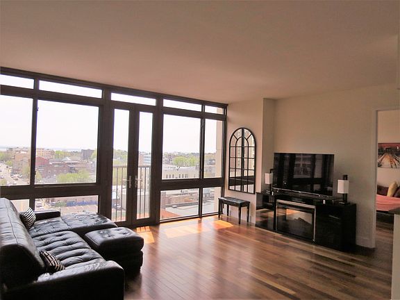 Large living room with floor to ceiling windows!