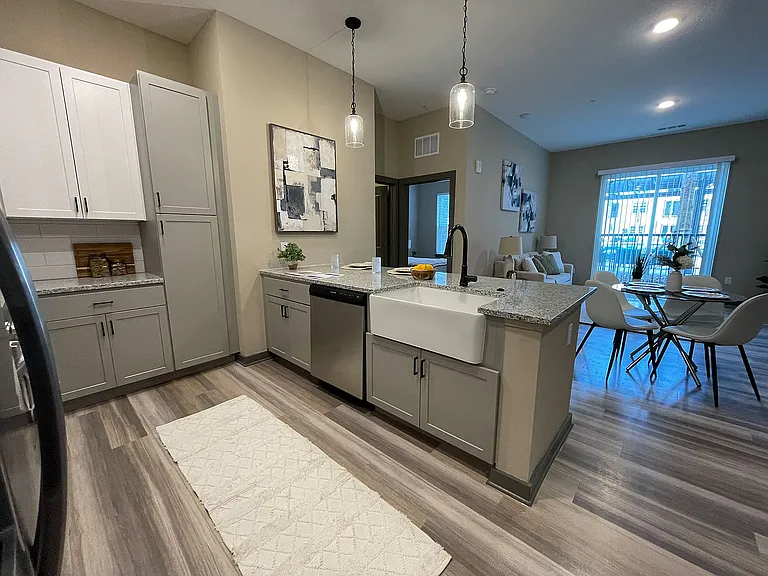 Explore this beautifully designed apartment with a stylish kitchen and cozy living space.