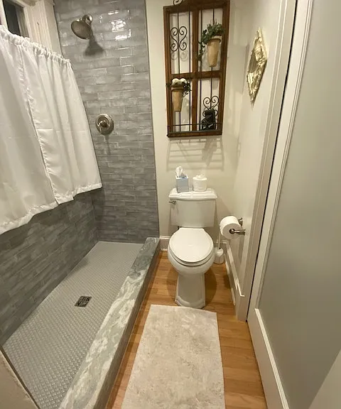 Second bedroom walk-in shower with glass wall.