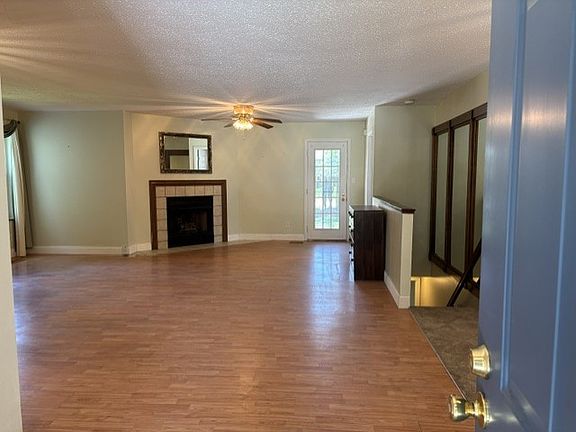 Great Room showing Gas Fireplace and stairs leading to finished Basement
