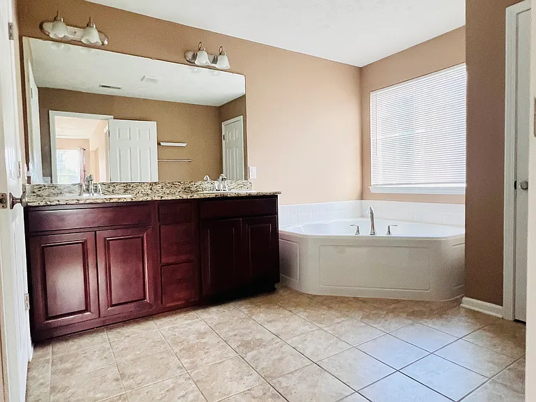 Primary bath with soaking tub and dual vanity