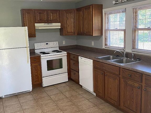 Large pantry cabinet with pull-out shelves.