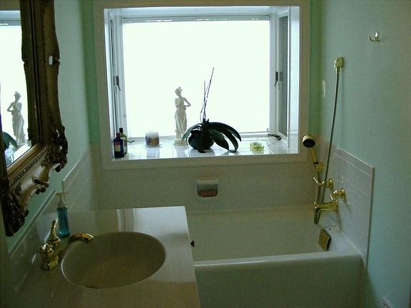Guest Bathroom with bay window and high ceilings.