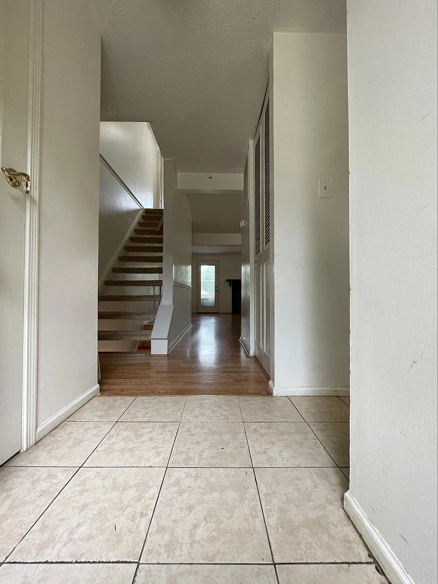 First floor hallway (left to powder room, right to kitchen area) - 7540 Rain Flower Way