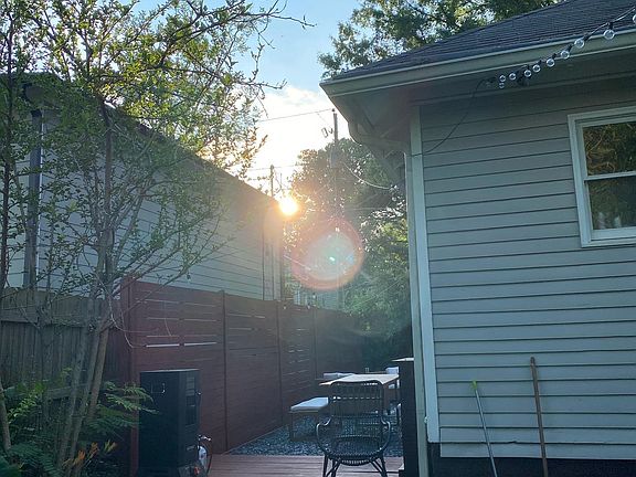 Enjoy peaceful evenings in the side yard with plenty of space for a smoker or a grill.