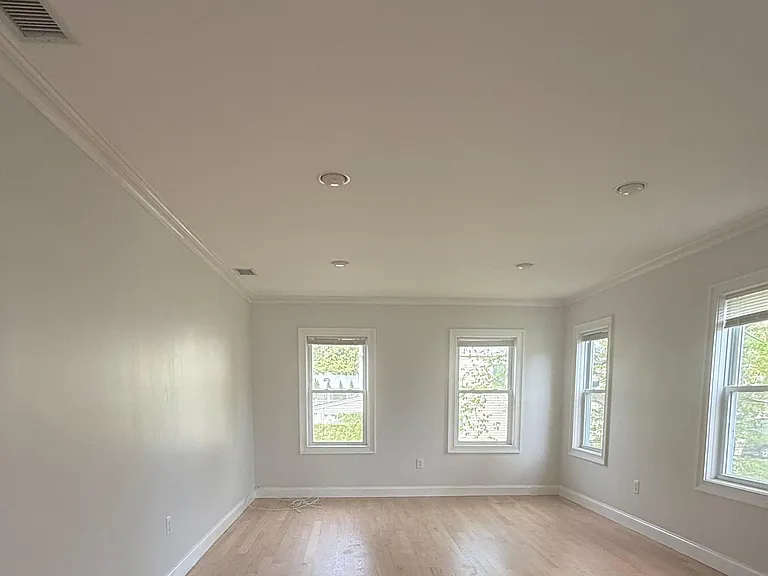Freshly painted and refinished floors in large bright Living Room