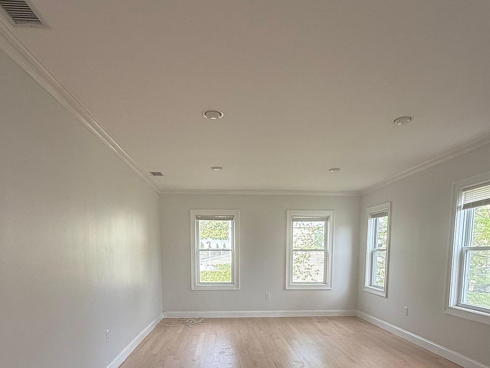 Freshly painted and refinished floors in large bright Living Room