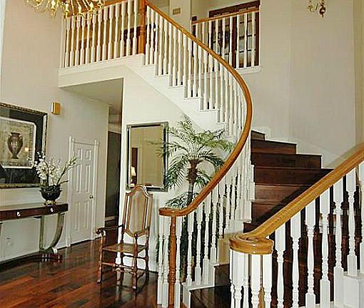 The curved stairway has wood steps! No carpet on the stairs-a big plus!