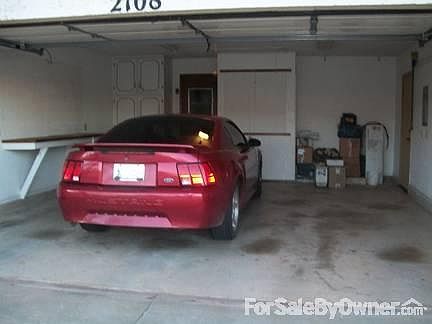 Garage with workbench and cabinets
