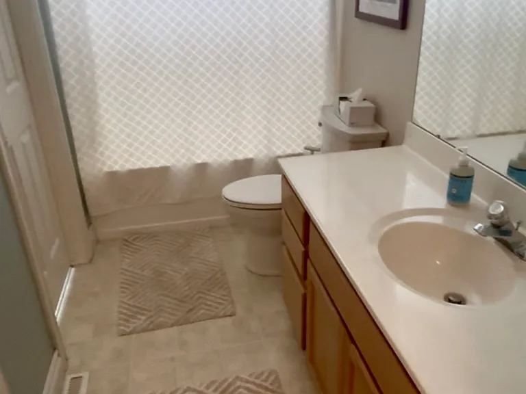 Upstairs bathroom (door on left goes to the largest bedroom)